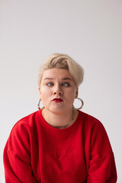 Portrait of blond woman with silly funny face