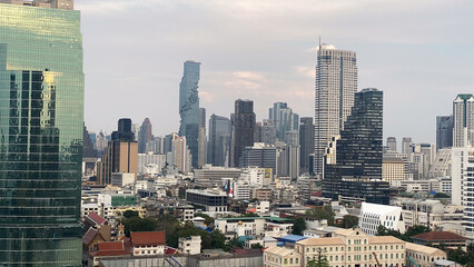 Naklejka premium Bangkok city view of a city with a river and a buildings in the background