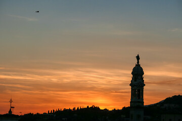 Scenic sunset view of tower of  church Chiesa di Sant Alessandro della Croce the town of Bergamo,...