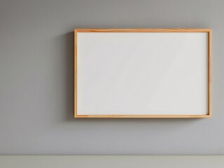 A white framed picture hangs on a wall