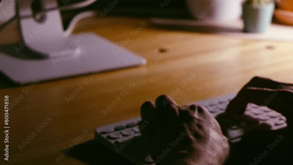 Wall mural a young man programmer coding on a laptop in the dark with a view of the lights of the night city, c