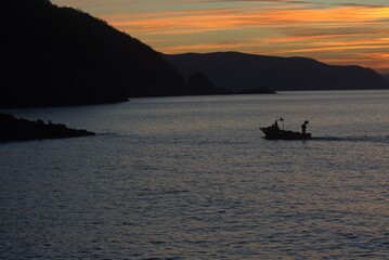 Fototapeta premium fishing boat in the sunset