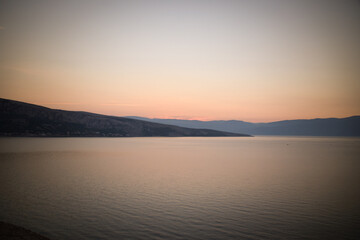 sunrise over the sea, clear sky without clouds. golden hour.	
