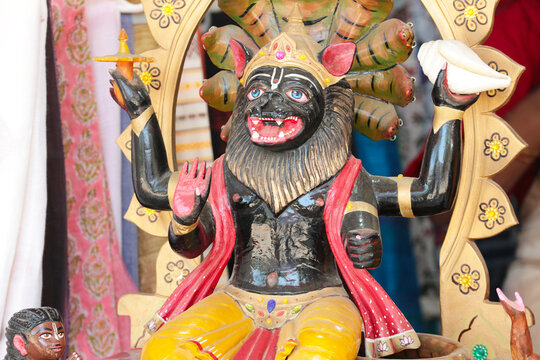 Wooden Deity Nrsimha - avatar of Vishnu. Hindu God.