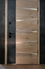 Brown entrance doors with linear lighting