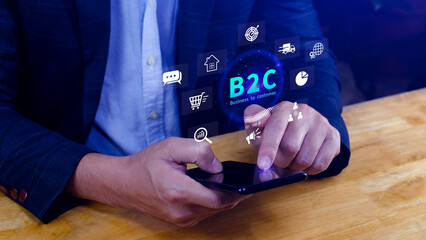 B2C, Business to customer marketing strategy concept. Businessman holding with virtual B2C icon for...