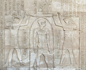 Wall relief of Ptolemy VIII Euergetes II Tryphon Purified by Thoth and Horus at the Temple of Sobek...