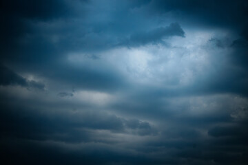 Clouds dark with rain and pattern. Soft selective focus. Artificially created grain for the picture