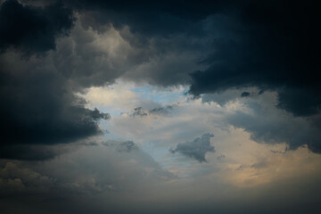 Clouds dark with rain and pattern. Soft selective focus. Artificially created grain for the picture