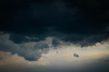 Clouds dark with rain and pattern. Soft selective focus. Artificially created grain for the picture