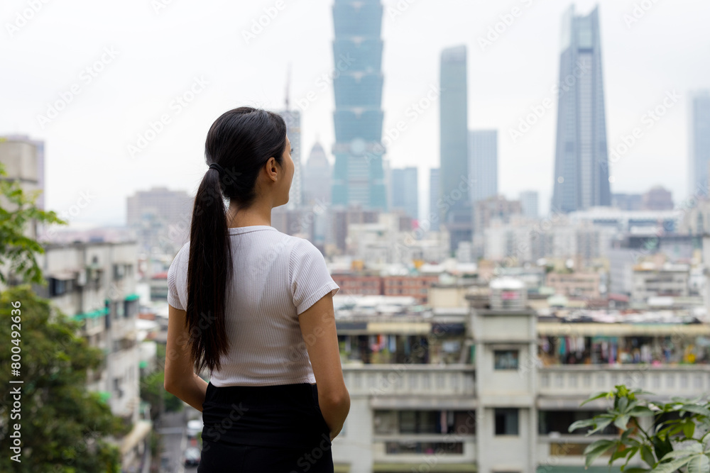 Poster woman enjoy the city view in taipei city