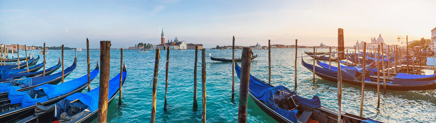 View of the gondolas of the Grand Canal on a sunny day in Venice, Italy. San Giorgio Maggiore.