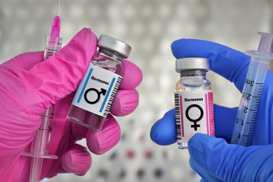 Transgender Hormone Therapy Injections Concept - Vials Of Testosterone Male And Estrogen Female Hormones For Treatment