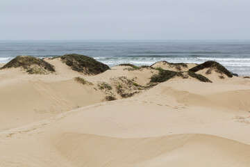 the famous ocean dunes at a cloudy morning day. Pier Ave of Oceano, California