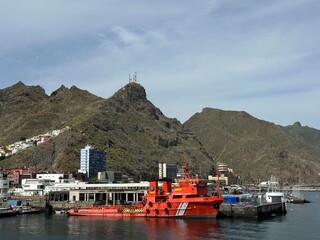 A red maritime rescue boat docked at the port of Santa Cruz de Tenerife, Canary Islands, Spain,...