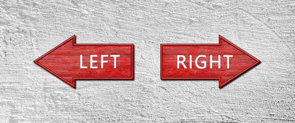 Red wooden arrow signs with the word LEFT and RIGHT hang on a plastered wall. Right and left arrow pointers. Set direction