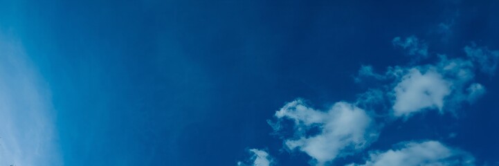 Expansive blue sky with wispy clouds, ideal for backgrounds or concepts like freedom, summer skies,...