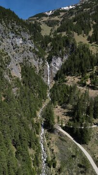 View to the dalfazer Waterfall with forest landscape and the Achensee as a close neighbor