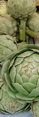 Fresh green artichokes close-up on display, ideal for culinary themes, healthy eating concepts, and Mediterranean diet-related content