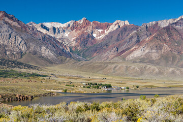 panoramic view over the Crowley lake to a iconic mountain range at a bright sunny summer day,...