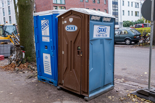 Hamburg, Germany - 12 03 2022: Two DIXI toilet cubicles on a construction site in Hamburg Germany