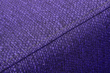 Textured violet furniture fabric with stitching