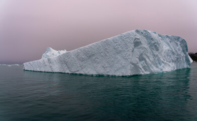 Large Iceberg solitary with aqua water Greenland