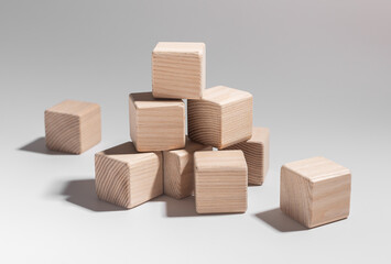 Wooden blocks stacked in educational play. Business and economy concepts learned through abstract