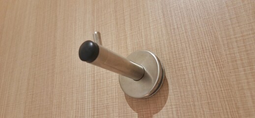 Door stopper wall. Stainless magnetic door in toilet