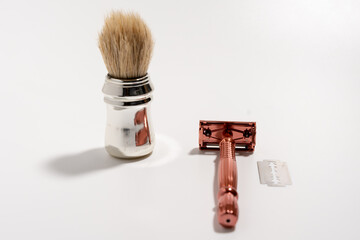 Metal razor and pen brush on a white background. Razor close-up.