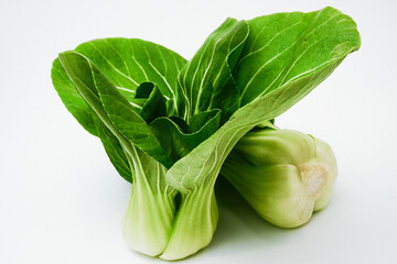Pak chai, chinese cabbage cut into pieces on white background