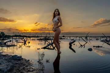 Tropical Tranquility: Radiant Beauty Strikes a Pose Amidst Lush Mexican Landscape as Yucatan...