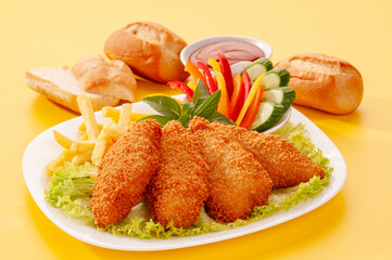 Fried Breaded fillets with fries and salad with dip