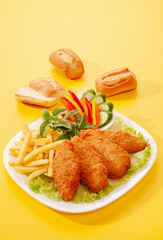 Fried Breaded fillets with fries and salad with dip