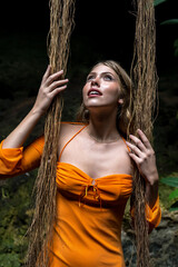 Serenity Unveiled: A Stunning Model's Bliss Amidst Cuzama's Enchanting Blue and Green Cenotes in Yucatan, Mexico