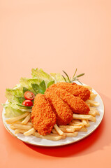 Spicy Tandoori Breaded Chicken Fried fillets with fires and salads