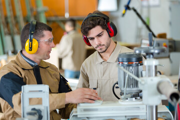 giving instructions to a future industrial technician