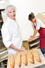 the bakeshop owners working with bread