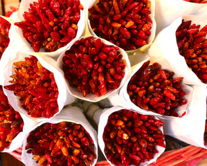 red spicy dried chili peppers on sale at the local fruit and vegetable market