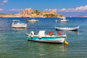 Fototapeta na wymiar Yachts and Old Venetian Fortress overlooking the Ionian Sea in Kerkyra, Corfu, Greece