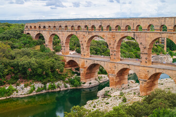 Panoramic view of ancient old Roman Aqueduct Pont du Gard ear Vers-Pon-du-Gard, Occitanie, France,...