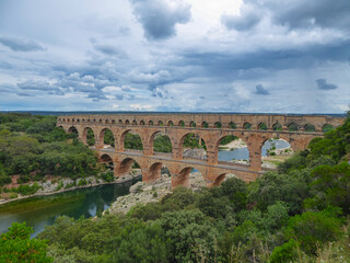 Panoramic view of ancient old Roman Aqueduct Pont du Gard ear Vers-Pon-du-Gard, Occitanie, France,...