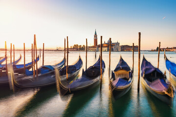 View of the gondolas of the Grand Canal bei sunrise in Venice, Italy. San Giorgio Maggiore.