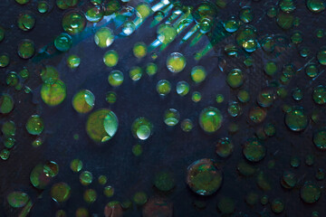  Drops of water of green color are located on a turquoise background. Abstract fantasy. 3D render.