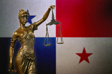 Lady Justice before a flag of Panama