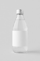 Small water bottle mockup with blank label. Clear glass.