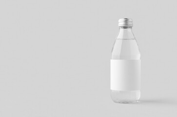 Small water bottle mockup with blank label. Clear glass, copyspace.