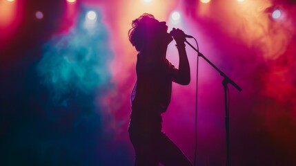 A dramatic silhouette of a singer on stage, microphone raised triumphantly against a backdrop of vibrant stage lights.