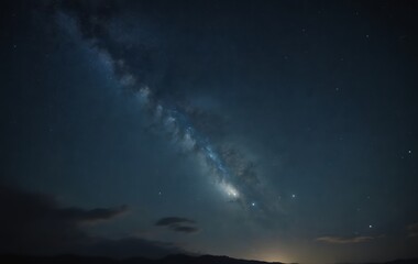 The Milky Way galaxy is visible over the mountains in the night sky