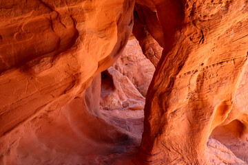 Interior view of windstone arch or fire cave in Valley of Fire State Park in Mojave desert near Las...